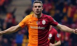 Podolski kramponlarını astı